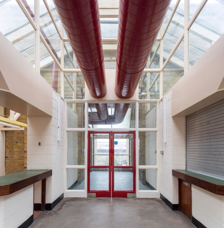 Red ductwork under the glazed roof