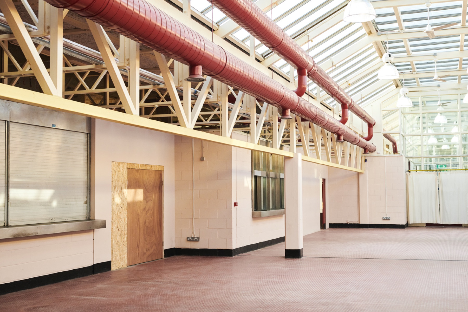 The Main Hall in afternoon sun, red ductwork overhead