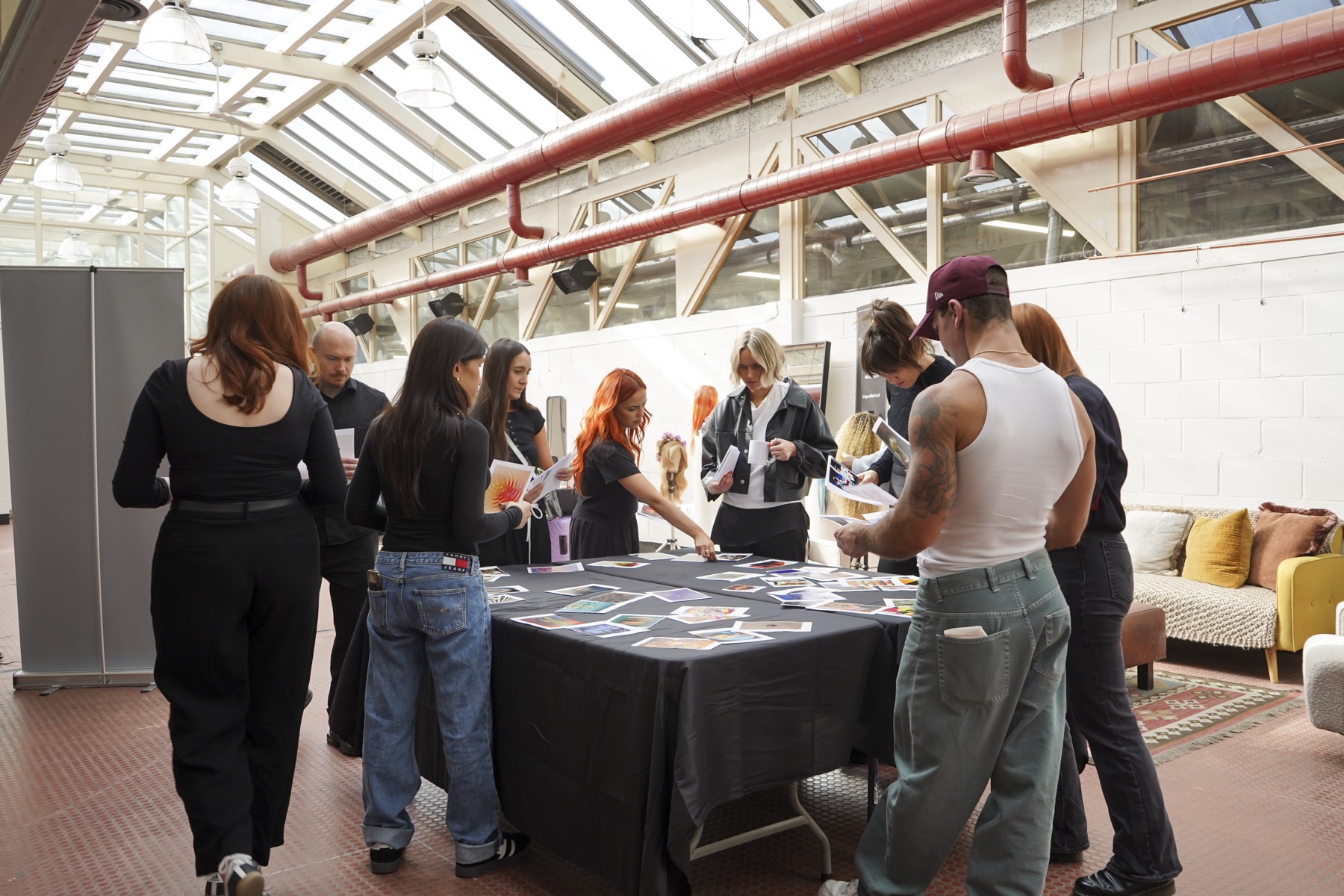 Guests gathered around a table at an event in the Main Hall